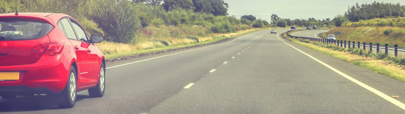 Car driving on a motorway.
